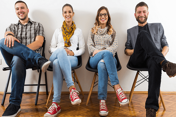 Group of people sitting in a row