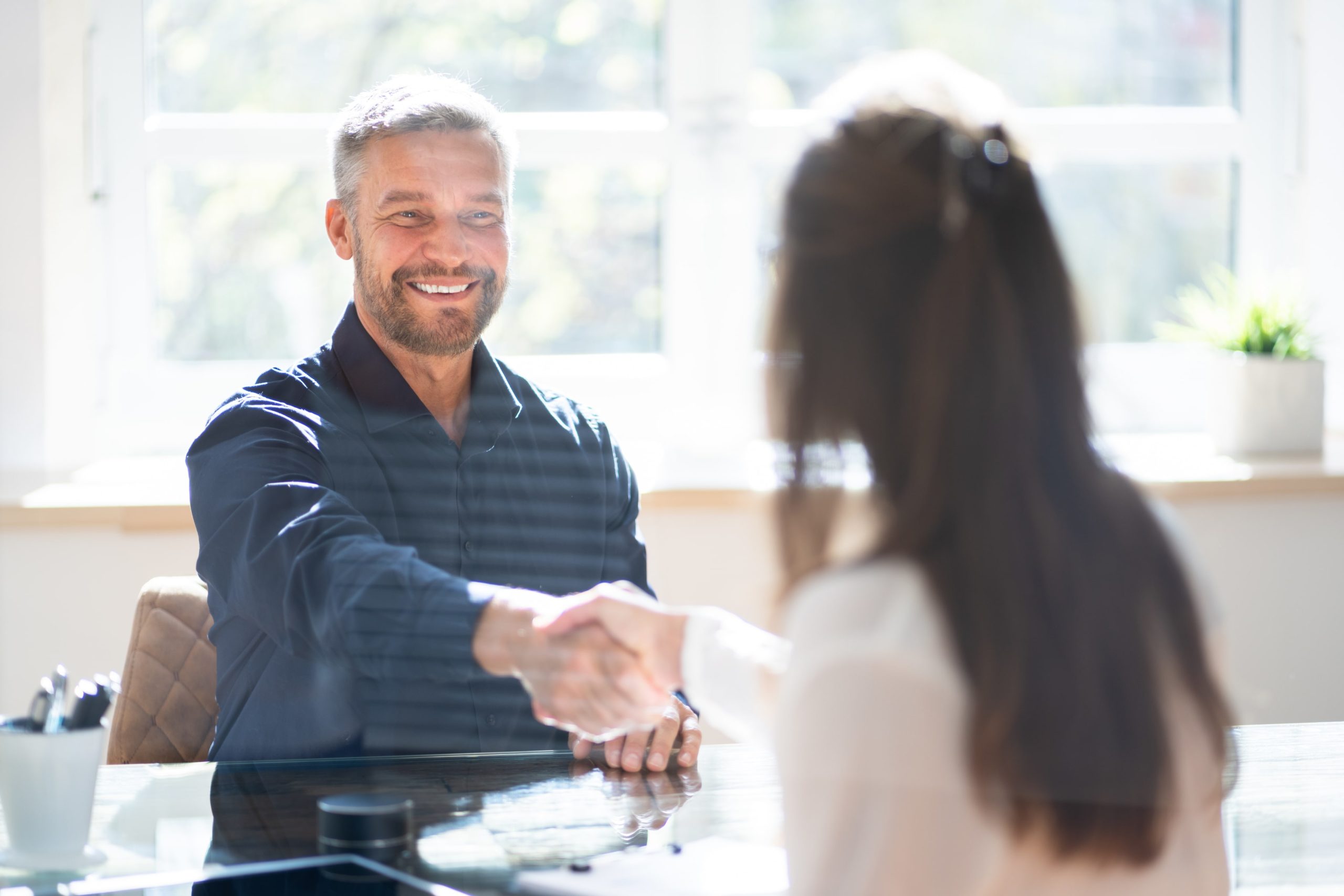 Employees shaking hands.