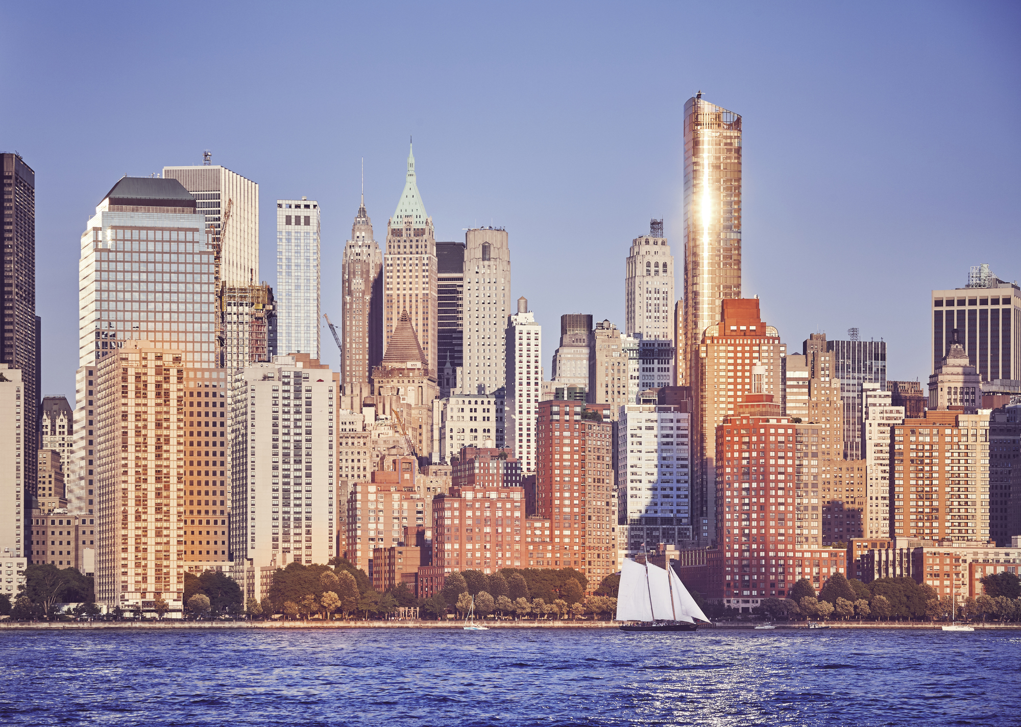 Manhattan at sunset, color toned picture, New York City, USA.